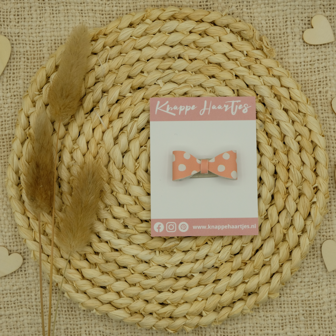 Haarstrikje zalm roze met witte stippen