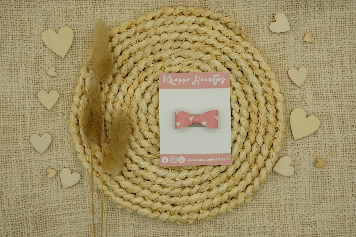 Haarstrikje roze met witte hartjes