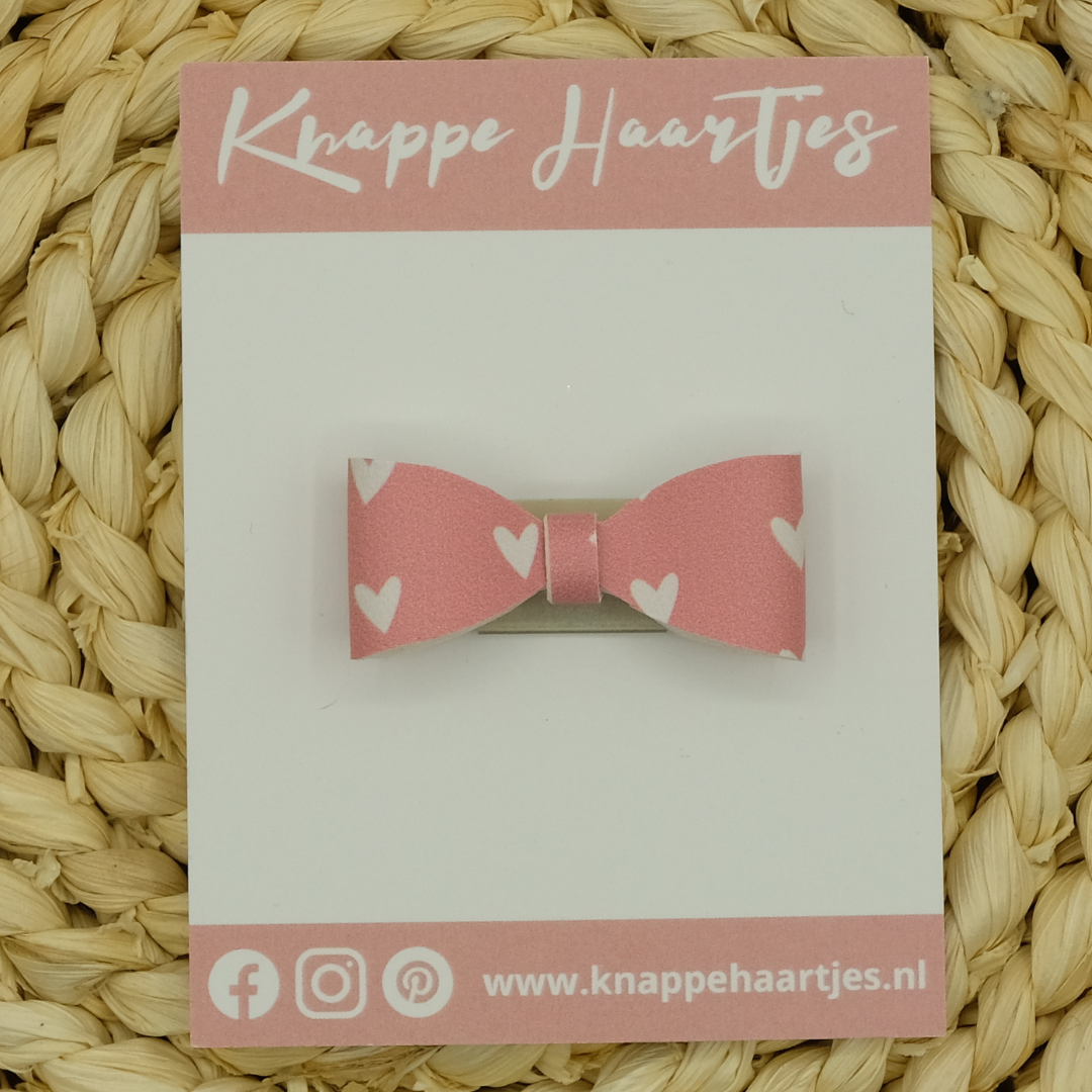 Haarstrikje roze met witte hartjes