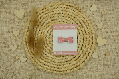 Haarstrikje roze met witte hartjes