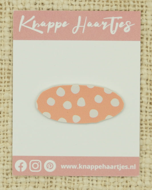 Ovaal zalm roze met witte stippen